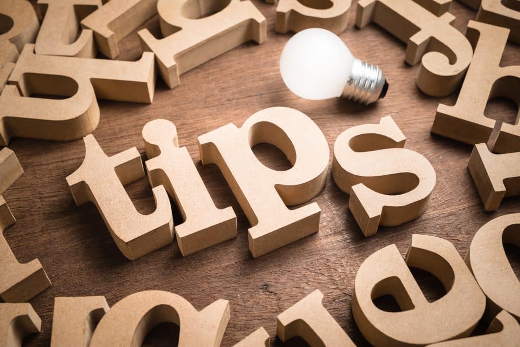 The word "Tips" in wooden letters