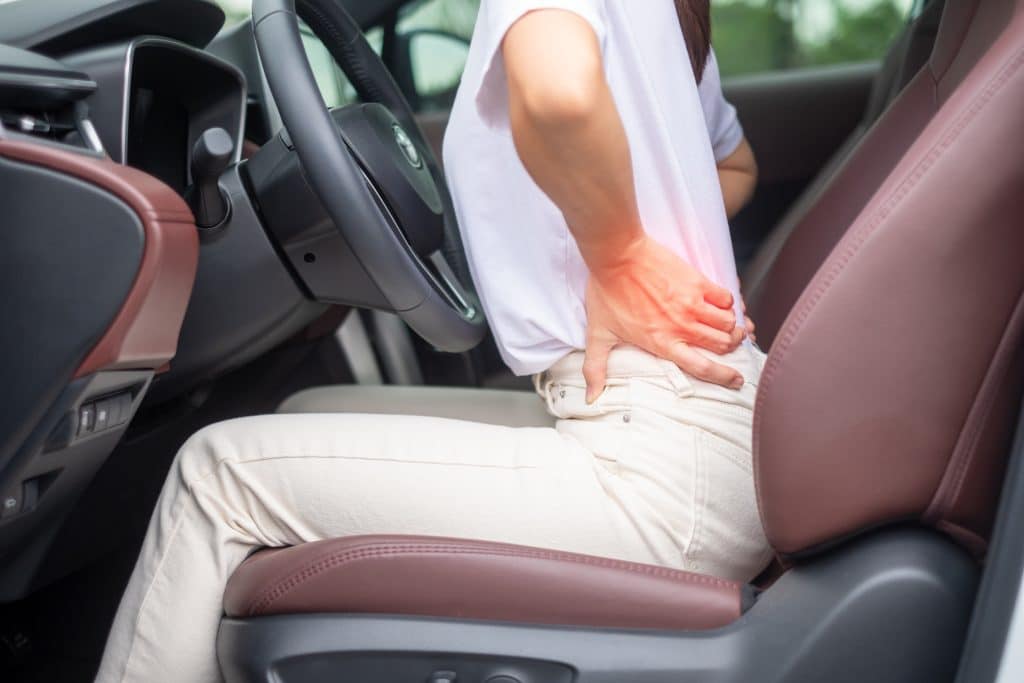 Person having back pain whilst driving