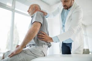 Doctor and patient talking about back pain