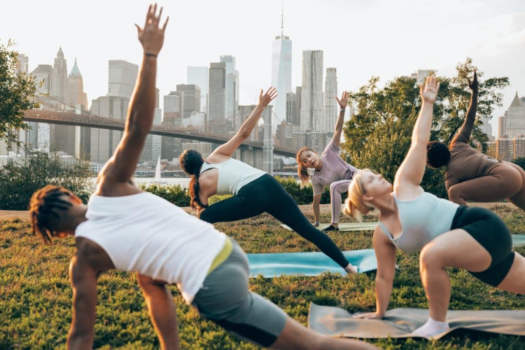People doing yoga outside in New York