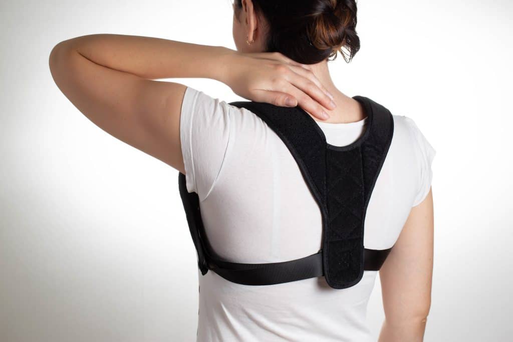 Person Wearing a Posture Corrector